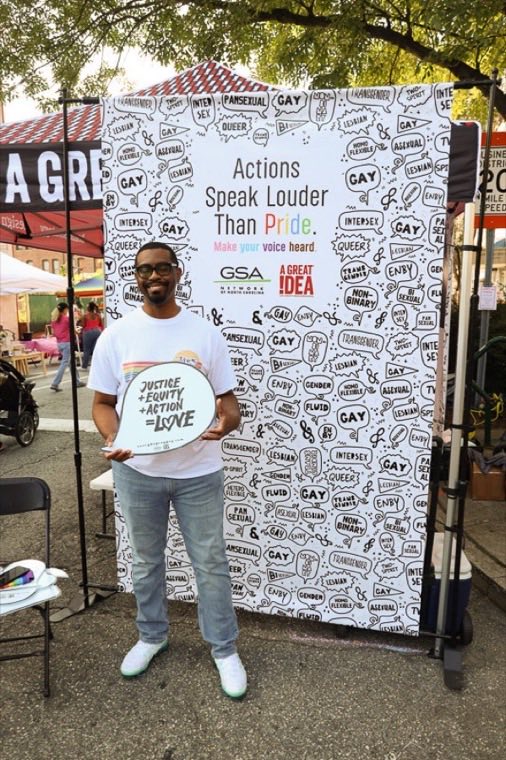 Advocate holding a Say Gay sign at a community event